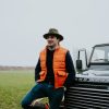 boy in bodywarmer orange