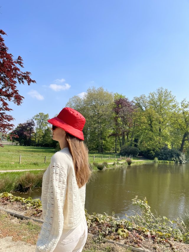 girl in bucket hat red