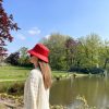 girl in bucket hat red