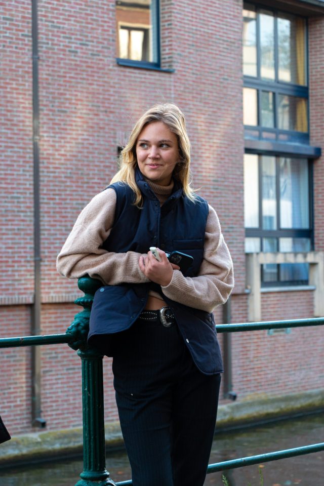 girl in navy vest