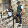 young couple in bottle green v-neck vest