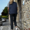 young girl in navy v-neck vest